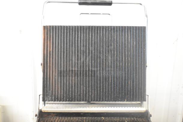 Waring WPG250 stainless steel commercial countertop panini press with ribbed plates, 120 volts, 1 phase. Good condition.