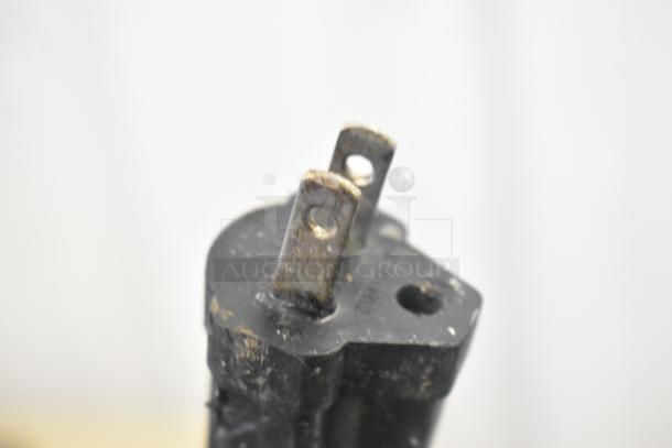 Close-up image of a worn plug for the Waring WPG250 Panini Press, showing slightly corroded prongs.