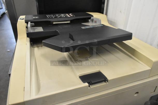 Kyocera AGK3 floor style copier, printer, scanner in used condition. Features control panel and feeding tray.