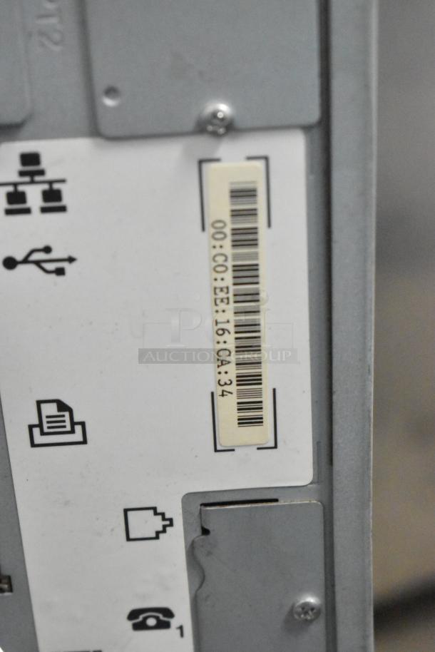 Kyocera AGK3 floor-style copier, printer, scanner with visible barcode, port icons. Model label shows: 00:CO:EE:16:CA:34.