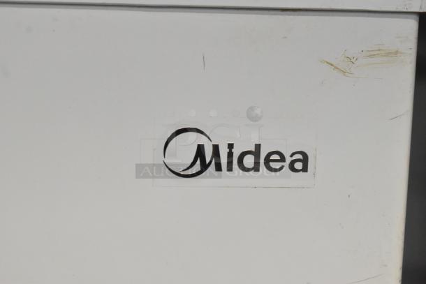 Midea MRC04M3AWW Chest Freezer with scratches on surface, logo visible. 115 Volts, 1 Phase. Model MRC04M3AWW.