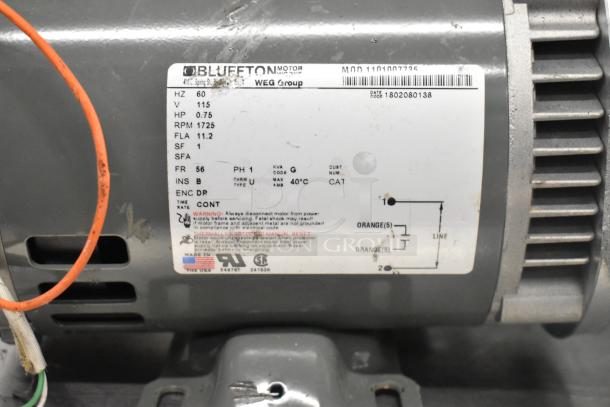 Bluffton 1101007735 Motor, 115V, 1 Phase, 0.75 HP, 1725 RPM. Label shows electrical specs and safety warnings.