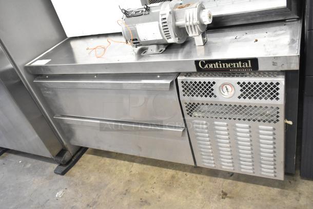 Continental DL48G stainless steel 2-drawer chef base on commercial casters, 115V, 1 phase, with visible motor and Continental logo.