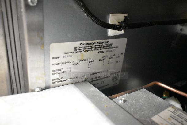 Continental DL48G stainless steel commercial 2-drawer chef base label, 115 volts, 1 phase, on commercial casters.