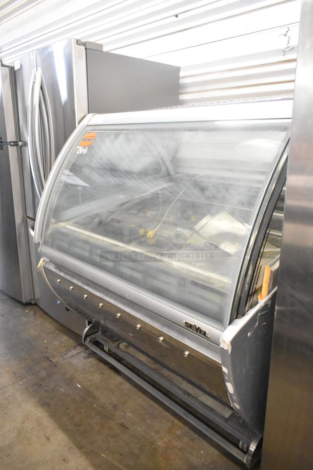 Sevel AD-12G metal gelato case merchandiser, floor style, 230 volts, 1 phase, visible wear, Sevel logo on front.