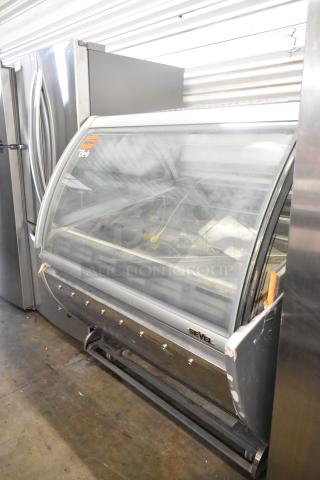 Sevel AD-12G metal gelato case merchandiser, floor style, 230 volts, 1 phase, visible wear, Sevel logo on front.