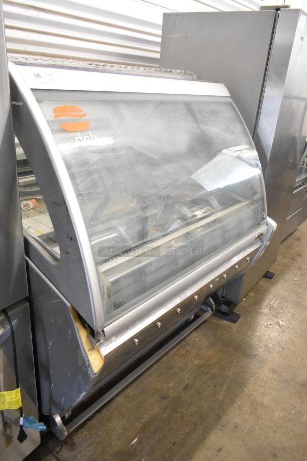 Sevel AD-12G gelato case merchandiser, metal, floor style, 230V, 1 phase, visible wear, clear curved display window.