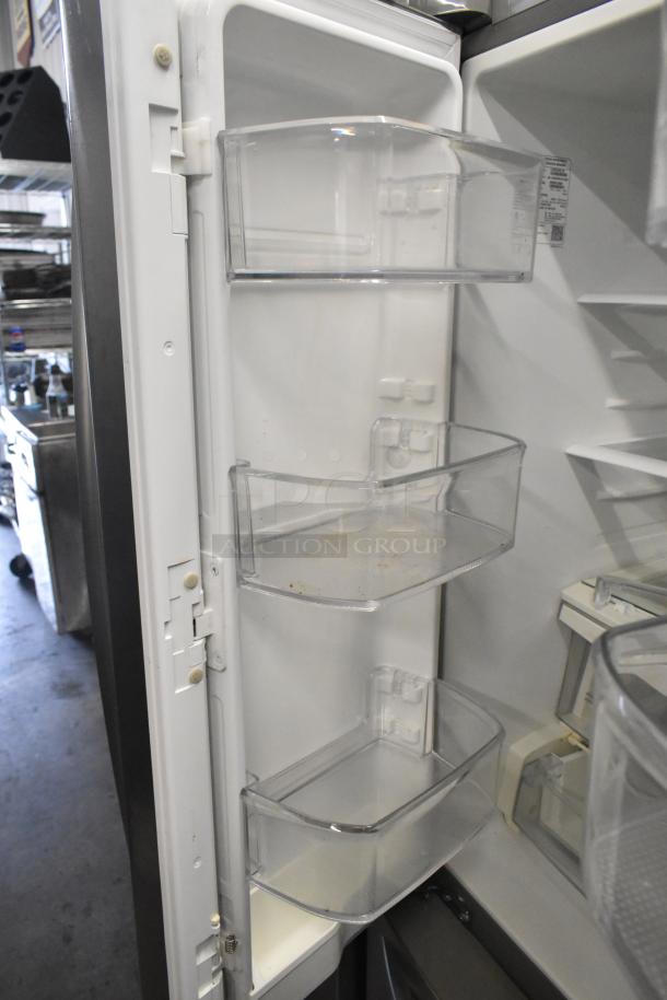 LG LFCS22520S stainless steel French style cooler with freezer drawer. Clean interior, adjustable clear shelves. 115V, 1 phase.