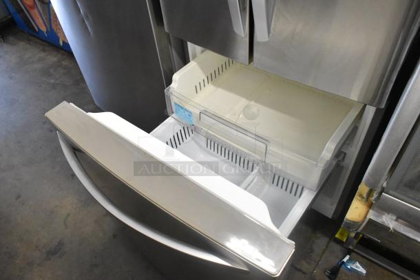 LG LFCS22520S stainless steel French door fridge with bottom freezer drawer, shown open. 115 volts, 1 Phase.