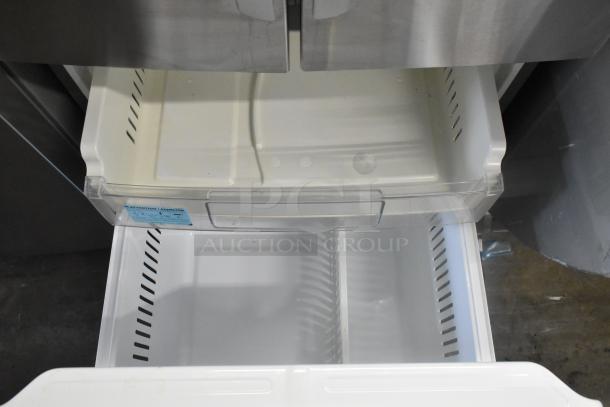 LG LFCS22520S stainless steel French door refrigerator, open freezer drawer, model label visible, 115V, 1 Phase.
