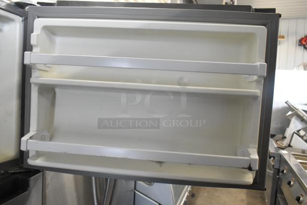 2016 Whirlpool WRT518SZFM00 stainless steel cooler with freezer, shown with open door shelves. 115V, 1 phase.
