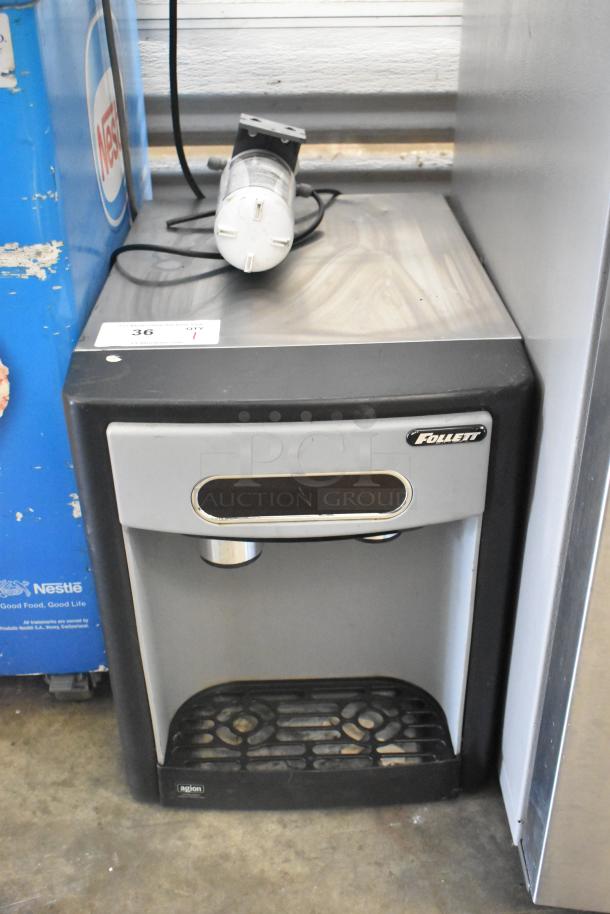 Follett 7CI100A countertop ice machine and water dispenser, 115V, 1 phase. Black and silver, features Agion antimicrobial protection.