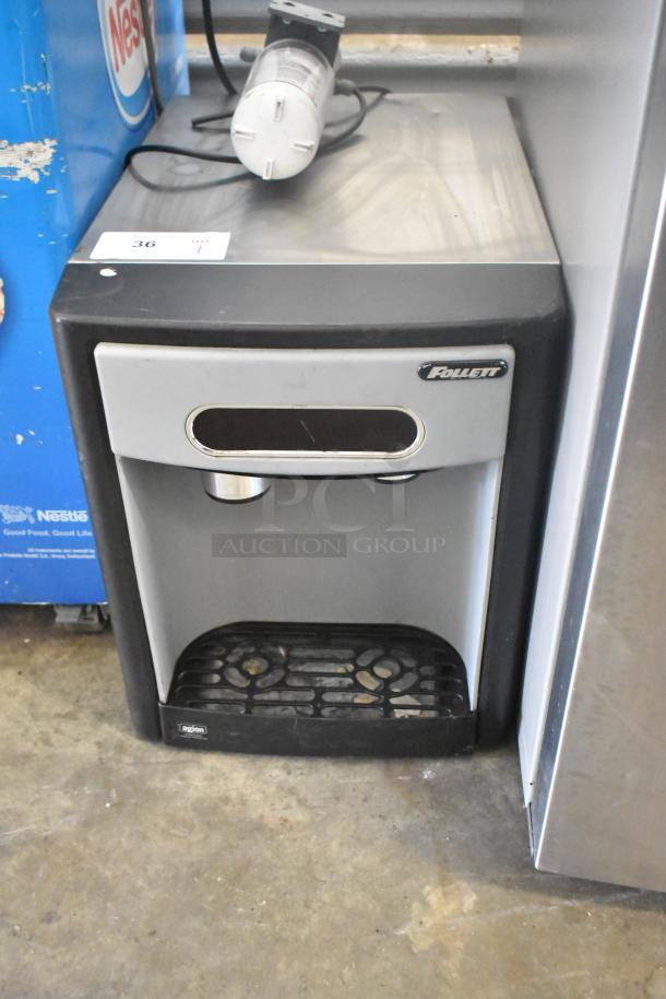 Follett 7CI100A metal countertop ice machine and water dispenser, 115 volts, 1 phase, in used condition.