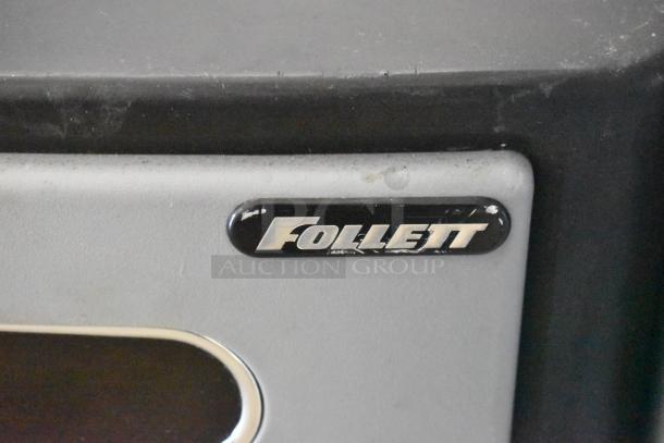 Follett 7CI100A metal countertop ice machine and water dispenser, 115 volts, 1 phase, visible brand logo, minor wear.