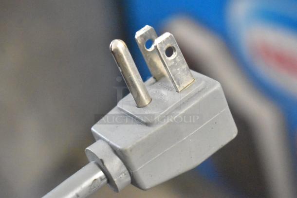 Close-up of a three-prong plug associated with the AHT RIO S 100 metal chest freezer merchandiser.