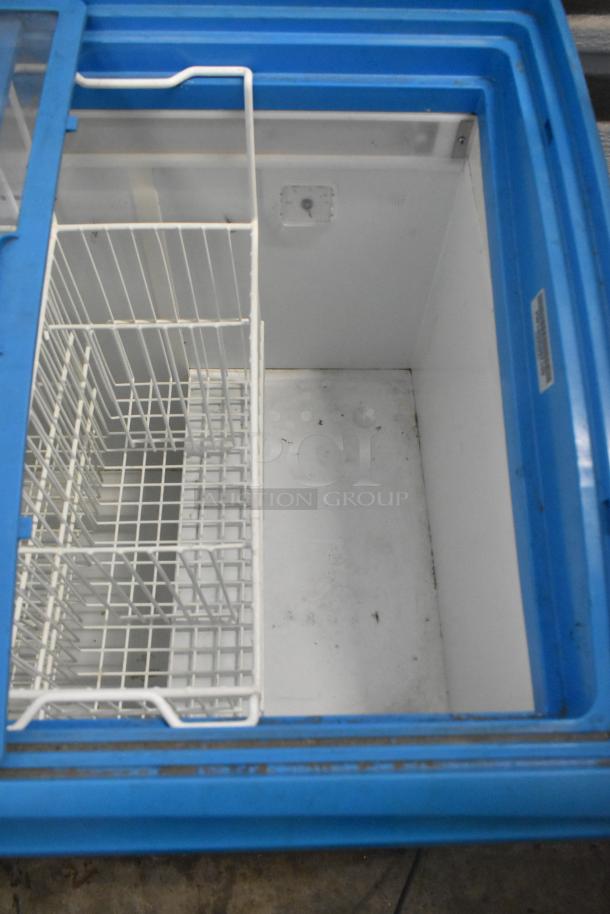 AHT RIO S 100 metal chest freezer with white wire baskets, blue trim, on commercial casters, 115 volts, 1 phase.