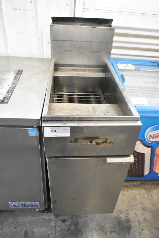 Stainless steel commercial floor-style gas fryer, with visible wear, Ikon branding, auction tag labeled "38".