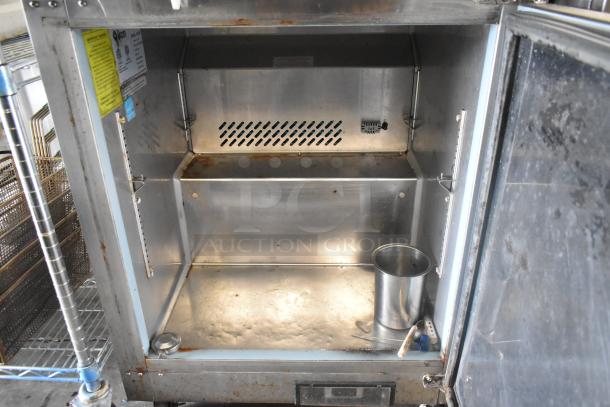 Ikon IUC28R stainless steel undercounter freezer, single door, on commercial casters. Visible interior and labels. 115 volts, 1 phase.