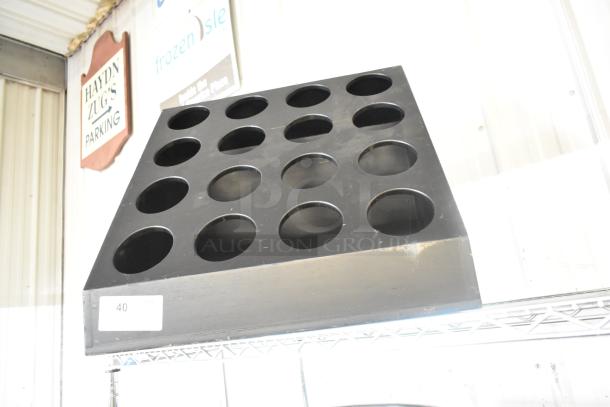 Black Poly 16 Cut Out Stand, featuring sixteen circular cutouts. In good condition with slight wear.