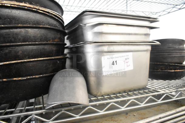 Tier lot of stainless steel drop-in bins, skillets, and metal bowls in used condition on metal shelving. Label: "41 QTY Tier lot".