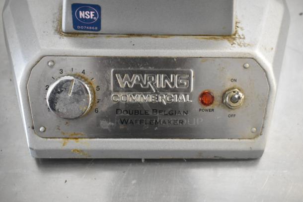 Waring WW200 Metal Countertop Waffle Maker, 120 Volts, 1 Phase, shows signs of use. Features power switch and temperature dial.