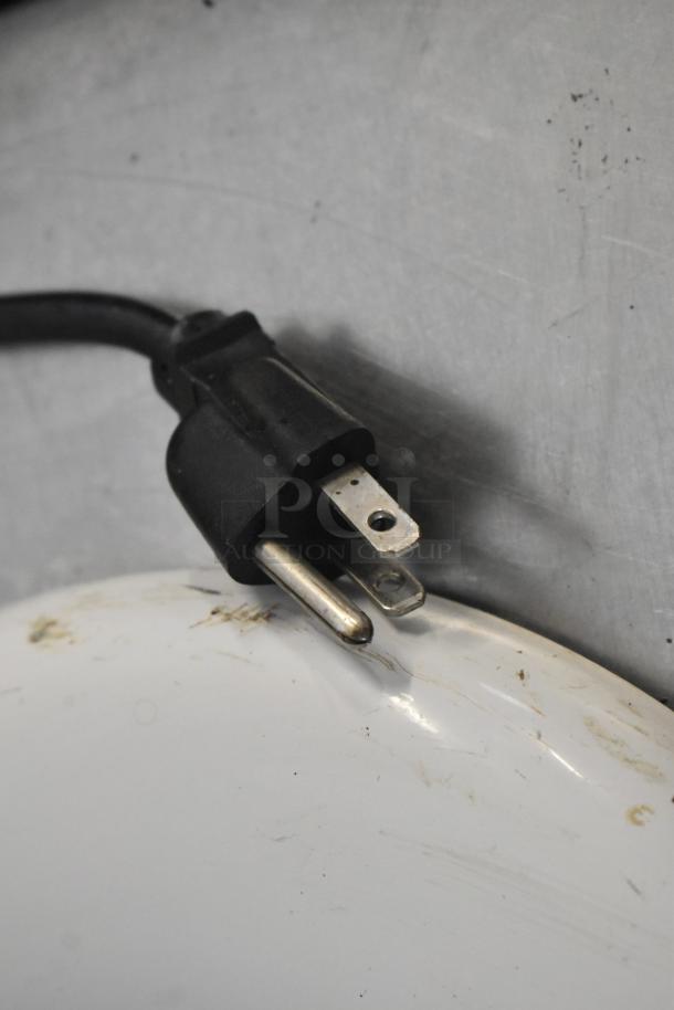 Plug and a portion of the KitchenAid 5 Quart Dough Mixer in used condition. Visible wear and a standard power cord.