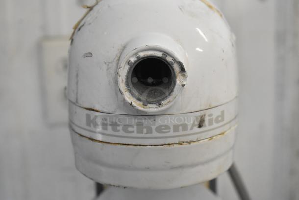 KitchenAid KV25G0XWW/KSMC50S mixer, metal countertop, 5 qt, includes 2 dough hooks and 1 paddle, visible wear on body.