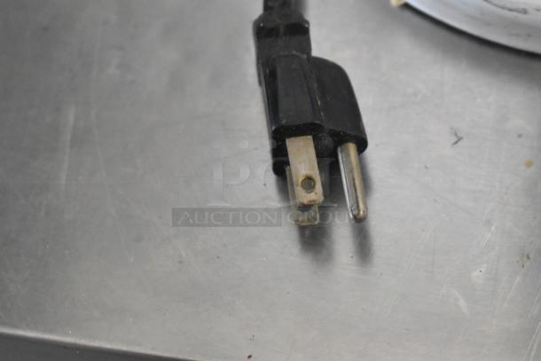 Close-up of a KitchenAid 115V power cord plug for the KV25G0XWW/KSMC50S 5-quart metal countertop dough mixer.