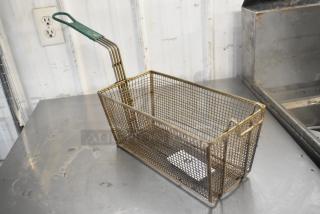 Metal fry basket with green handle, rectangular shape, used condition, mesh design for deep frying. Lot of 4 available.