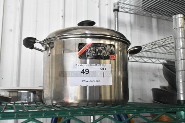 Potking metal stock pot with lid, stainless steel, black handles, visible Potking label, as-new condition, on storage shelf.