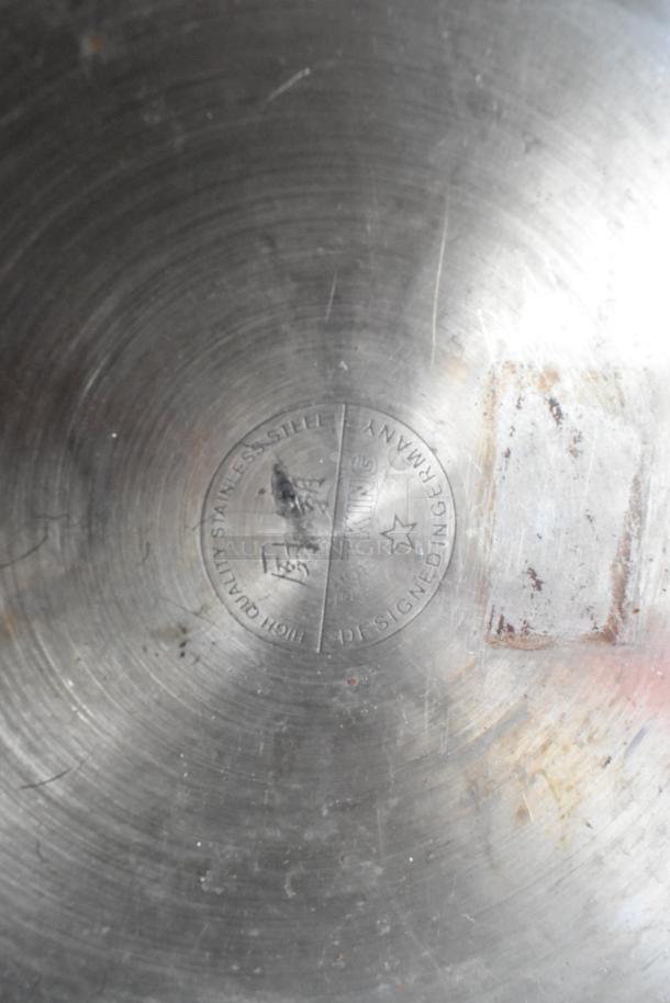 Potking metal stock pot, stainless steel, marked "High Quality Stainless Steel," used condition, visible wear.