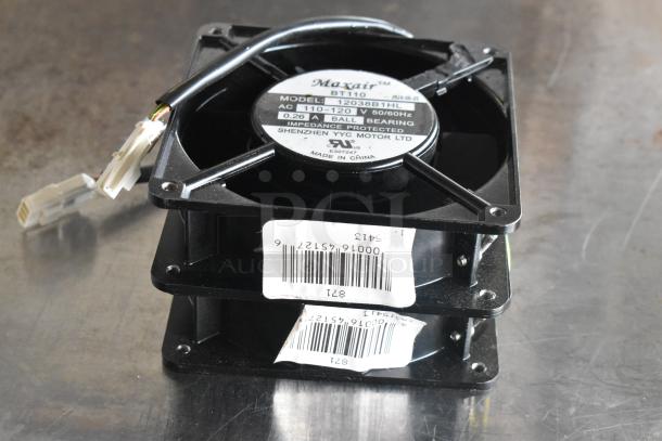 Two Maxair BT110 fans, black plastic with wiring visible, labels indicate AC 110-120V, 0.26A, ball bearing.