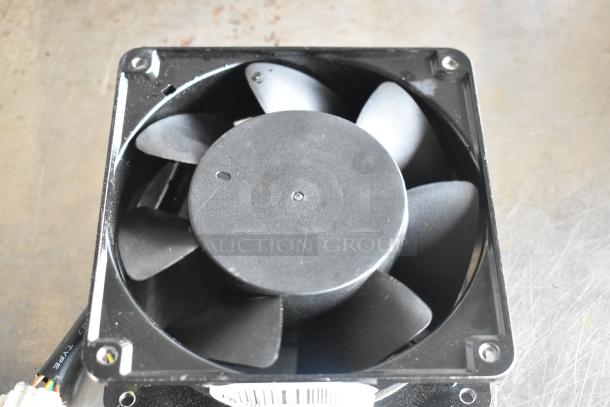 Alt text: Maxair BT110 fan, black blades and casing, with visible wire connection and label on the side.