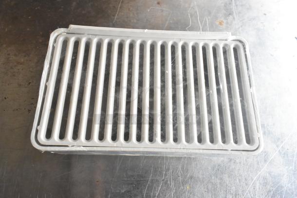 White plastic drip tray with slotted design, part of a lot including 2 Maxair BT110 fans and wire, auctioned at 4x bid.