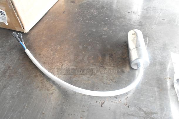 Silver fan motor on a metal surface, part of a lot with Maxair BT110 Fans, drip tray, and wire; auction item.