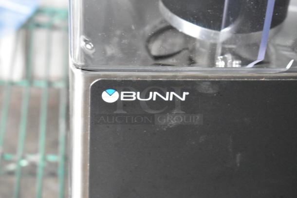 2024 Bunn LPG-2E stainless steel coffee grinder, commercial countertop model. Features 120 volts, 1 phase. Visible brand logo.