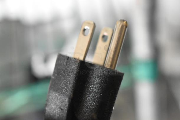 Close-up of a 3-prong plug for the 2024 Bunn LPG-2E coffee grinder, 120V, 1 Phase. Part of stainless steel commercial equipment.