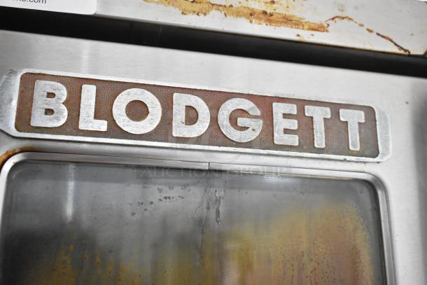 Blodgett stainless steel commercial gas convection oven with view-through doors, metal racks, and thermostatic controls.