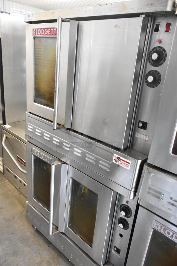 Blodgett stainless steel commercial gas convection oven with metal racks and thermostatic controls on casters.
