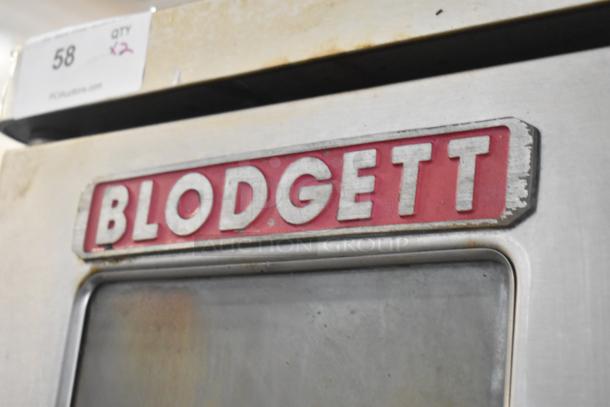 Blodgett stainless steel commercial gas convection oven, full size, with thermostatic controls, metal racks, on casters.