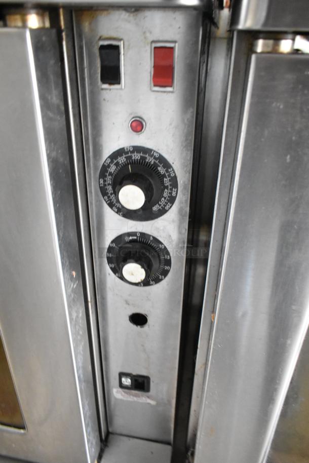 Blodgett stainless steel commercial gas convection oven controls; features knobs, buttons, and casters.