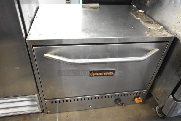 Sierra stainless steel commercial countertop pizza oven, with front handle and control knob, showing visible wear.