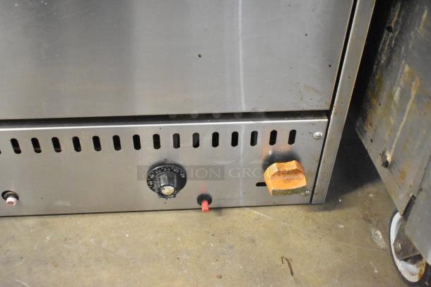 Sierra stainless steel commercial countertop pizza oven, featuring temperature control knobs, showing light wear.