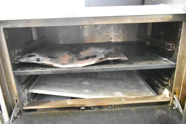 Sierra Stainless Steel Commercial Countertop Pizza Oven, visible interior racks, used condition, ideal for small businesses.