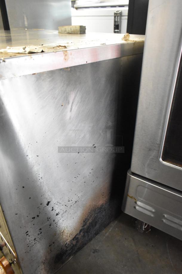 Sierra stainless steel commercial countertop pizza oven, showing signs of wear with surface stains and scratches.