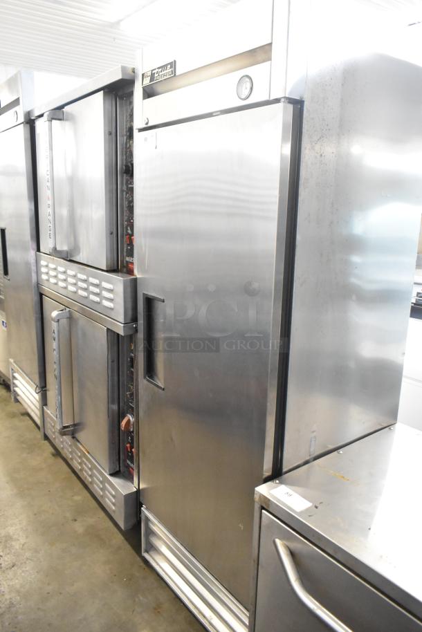 True T-19F stainless steel commercial single-door reach-in freezer, 115 volts, 1 phase, used condition, visible True label.