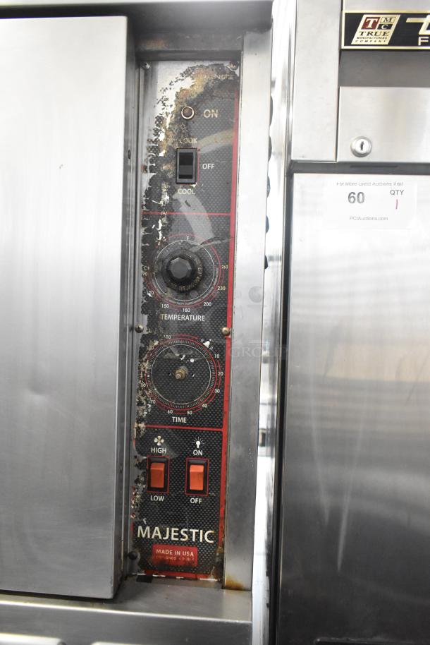 American Range Majestic stainless steel convection oven, solid doors, thermostatic controls, on commercial casters, used condition.