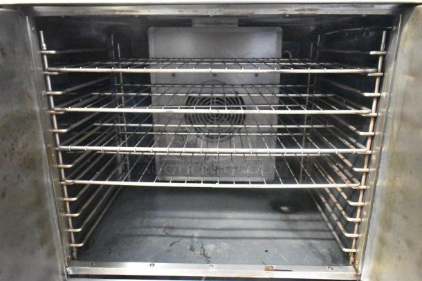 American Range Majestic stainless steel convection oven interior, multiple racks, robust build, on commercial casters.