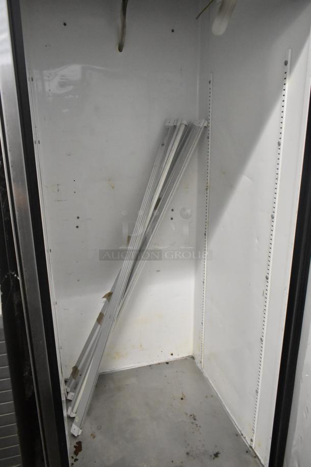 True T-23F stainless steel commercial single door reach-in freezer, interior view. 115 volts, 1 phase, shelves included.