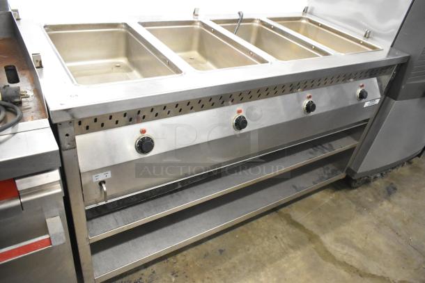 Stainless Steel 4 Well Steam Table with Under Shelf and Casters, featuring control knobs and sturdy construction.